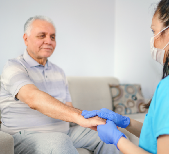 Nurse taking man's pulse