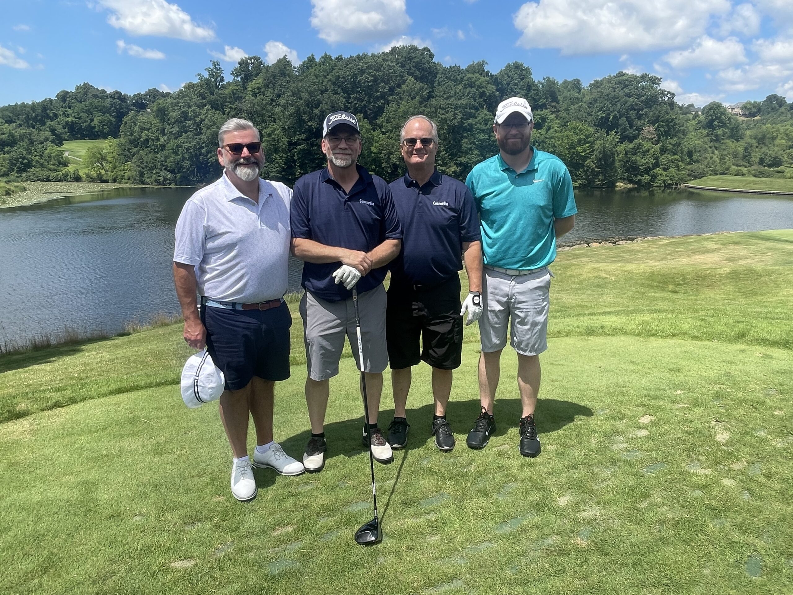 Four golfers on the green
