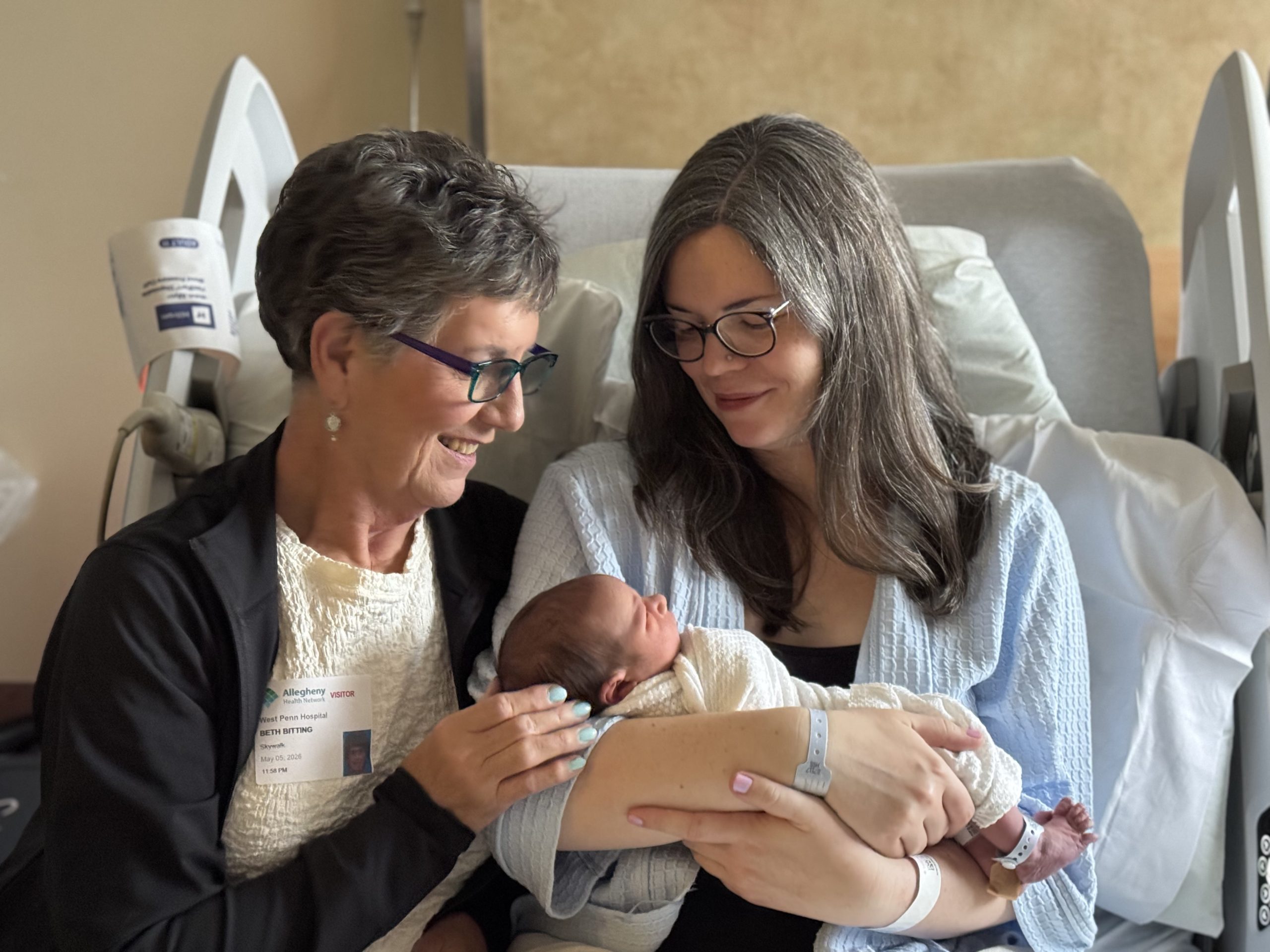 Emily Bitting-Jha holds her baby alongside her own mother Beth Bitting.