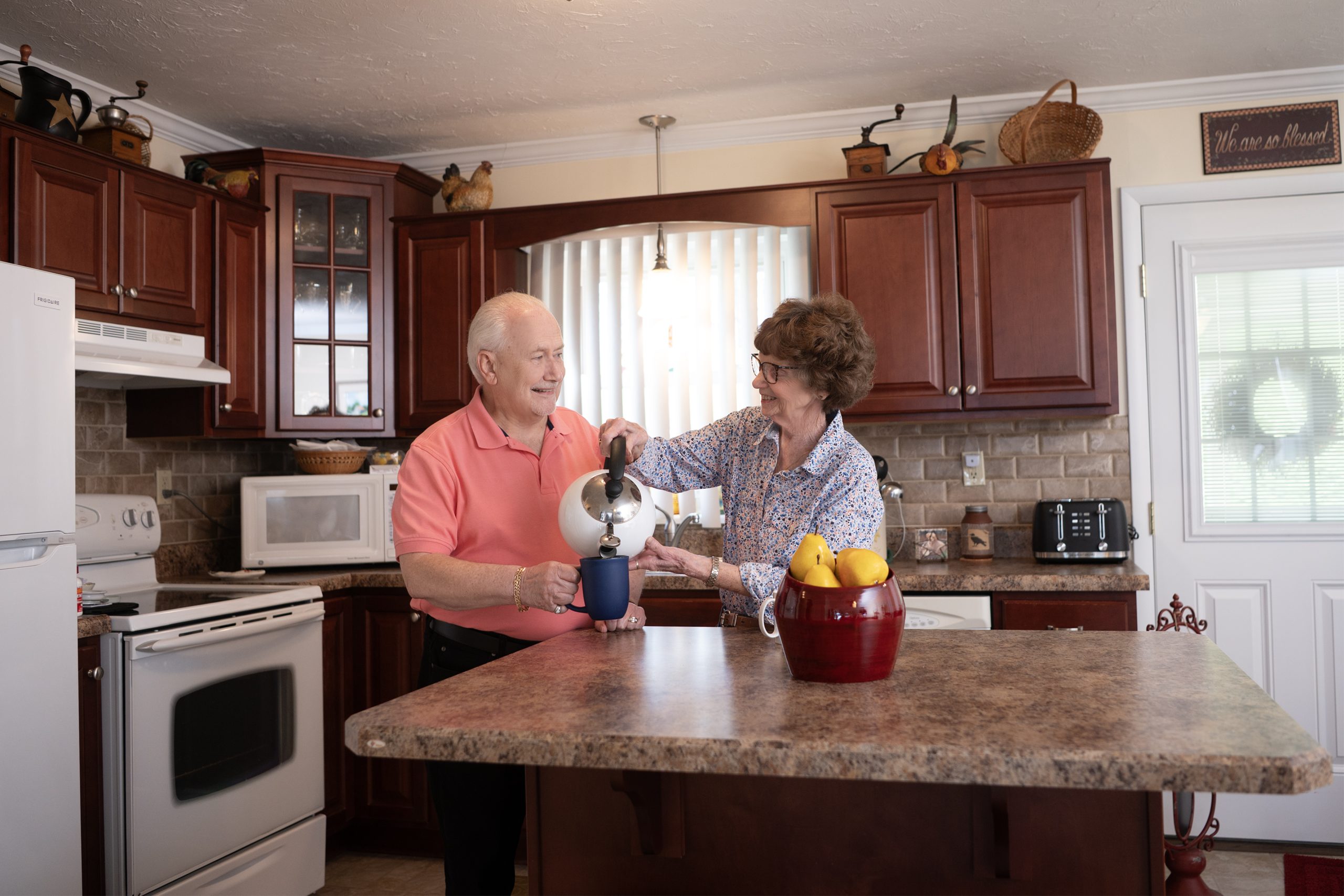 Retirement living residents of Concordia at Arbutus Park enjoy time in their kitchen